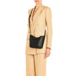 Il Bisonte Le Laudi Crossbody Bag in Nero with adjustable strap and minimalist silhouette.