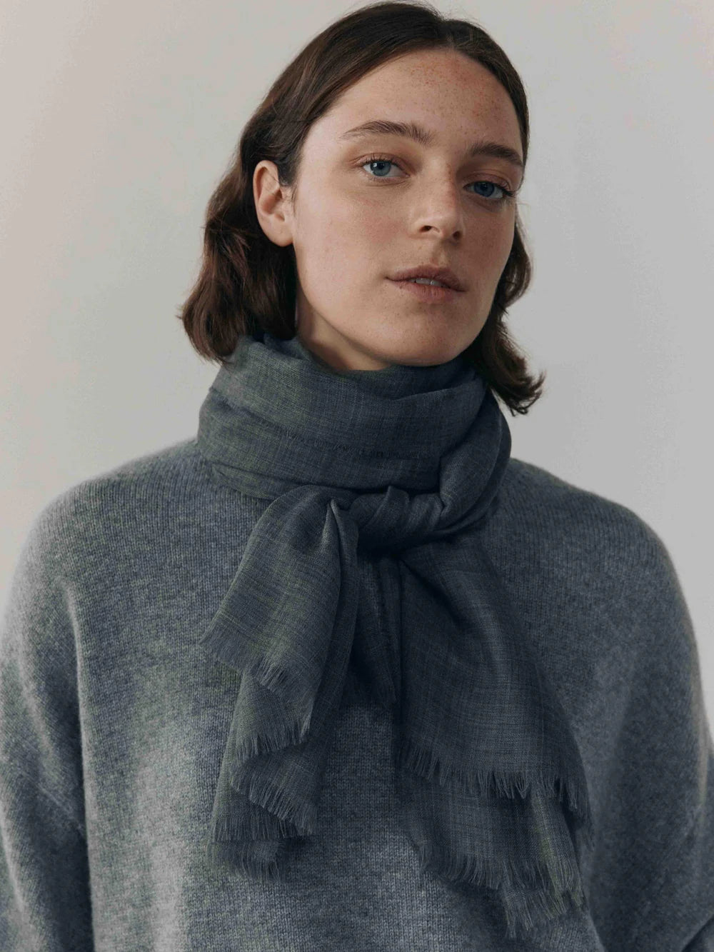 Close-up of Begg x Co Wispy Scarf showing airy cashmere texture and artisan craftsmanship.