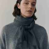 Close-up of Begg x Co Wispy Scarf showing airy cashmere texture and artisan craftsmanship.