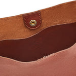 Close-up of Il Bisonte Seppia crossbody bag showing fine Tuscan craftsmanship and patina.