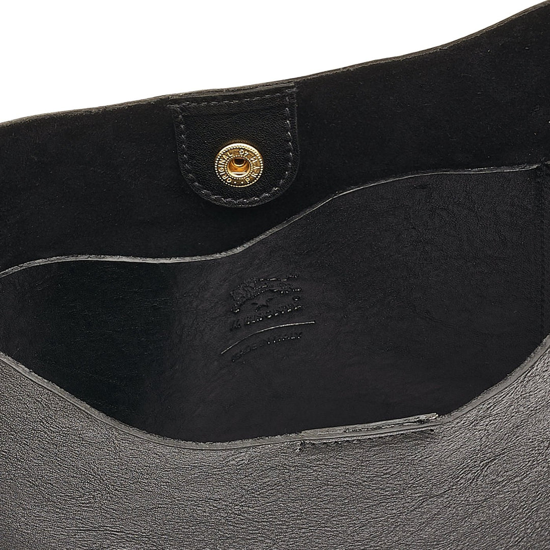 Close-up of Il Bisonte Nero crossbody bag showing smooth full-grain texture and Tuscan craftsmanship.