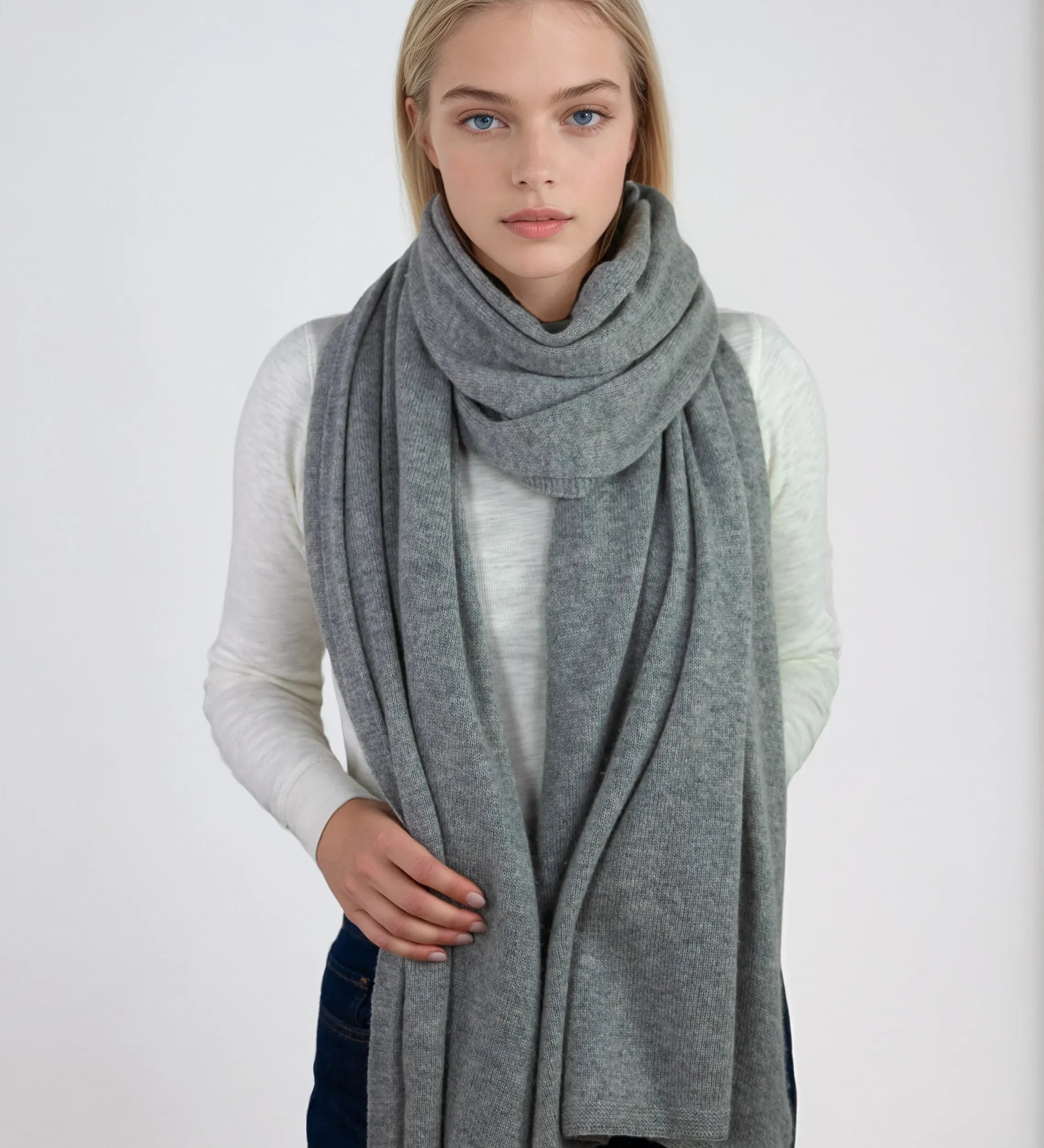 Oversized light gray cashmere Scottish cashmere stole designed in Telluride and made in the USA. Ideal for travel, layering, or staying warm in style.
