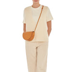 Model wearing the Il Bisonte Snodo crossbody bag styled with elevated Italian-inspired everyday dressing