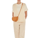 Model wearing the Il Bisonte Snodo crossbody bag styled with elevated Italian-inspired everyday dressing
