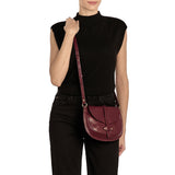 Front view of the Il Bisonte Archivo Saddle Bag in Black Cherry, crafted from vegetable-tanned Italian leather with iconic loop closure.