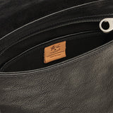 Close-up detail of the Brolio Men’s Crossbody in Black highlighting nickel hardware, stitching, and full-grain leather texture.
