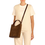 Side angle of the Le Laudi Bucket Bag in Caffè showing the adjustable strap, soft silhouette, and rich brown Italian leather finish.