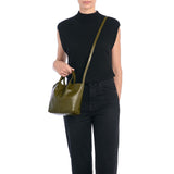 Front view of the Il Bisonte Nina Crossbody Bag in Verde, crafted in Tuscany from vegetable-tanned Italian leather with soft pleating and brass hardware.