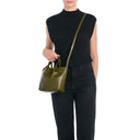 Front view of the Il Bisonte Nina Crossbody Bag in Verde, crafted in Tuscany from vegetable-tanned Italian leather with soft pleating and brass hardware.