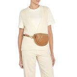 Side angle of the Oliveta Fanny Pack in Gianduia showing the zip closure, studded strap adjustment, and smooth Italian leather texture.