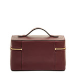 Side detail of the Il Bisonte Musa Travel Case in Black Cherry showing reinforced leather handle, brass hardware, and hand-stitched zipper pull.