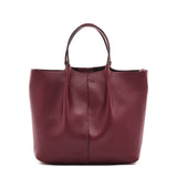 Maroon leather tote bag on a white background
