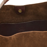 Close-up detail of the Il Bisonte Le Laudi Bucket Bag in Caffè showcasing the drawstring closure, brass hardware, and full-grain vegetable-tanned leather.