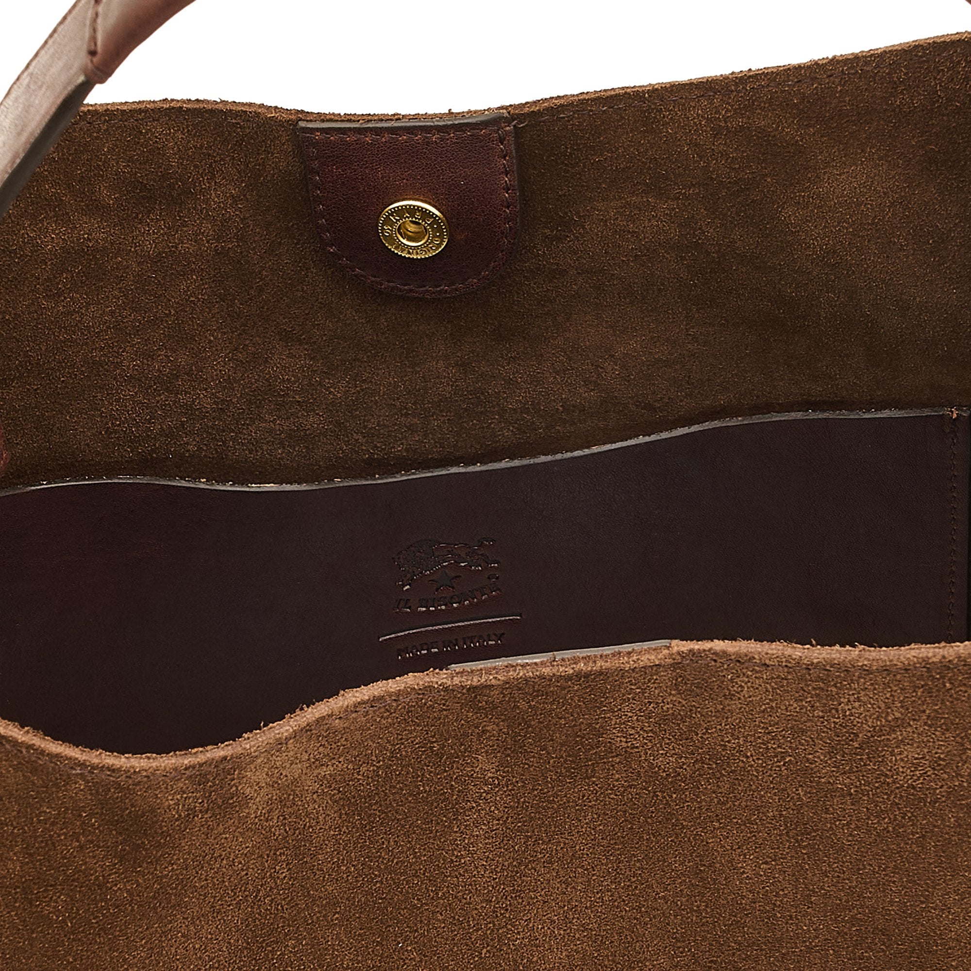 Close-up detail of the Il Bisonte Le Laudi Bucket Bag in Caffè showcasing the drawstring closure, brass hardware, and full-grain vegetable-tanned leather.