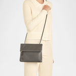 Handcrafted Italian leather crossbody bag by Il Bisonte featuring fold-over flap closure and sleek silhouette.