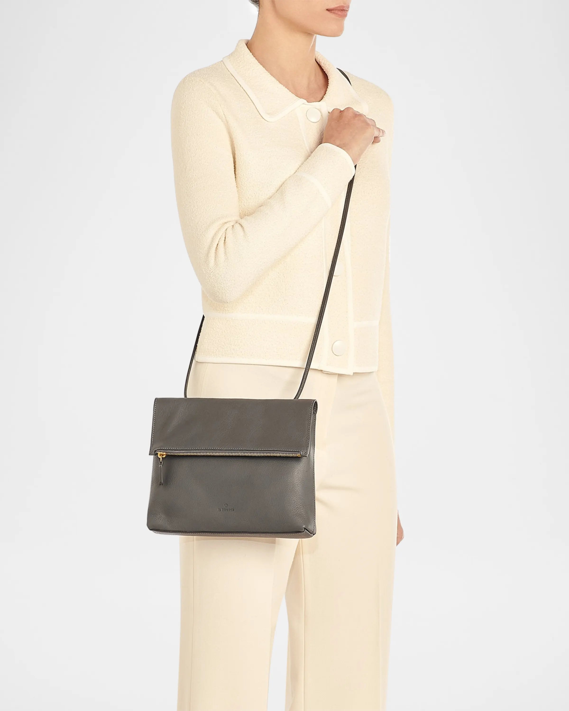 Handcrafted Italian leather crossbody bag by Il Bisonte featuring fold-over flap closure and sleek silhouette.