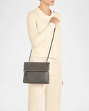 Handcrafted Italian leather crossbody bag by Il Bisonte featuring fold-over flap closure and sleek silhouette.