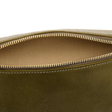 Close-up detail of the Il Bisonte Oliveta Fanny Pack in Verde highlighting the vegetable-tanned leather grain, zipper pull, and hardware.