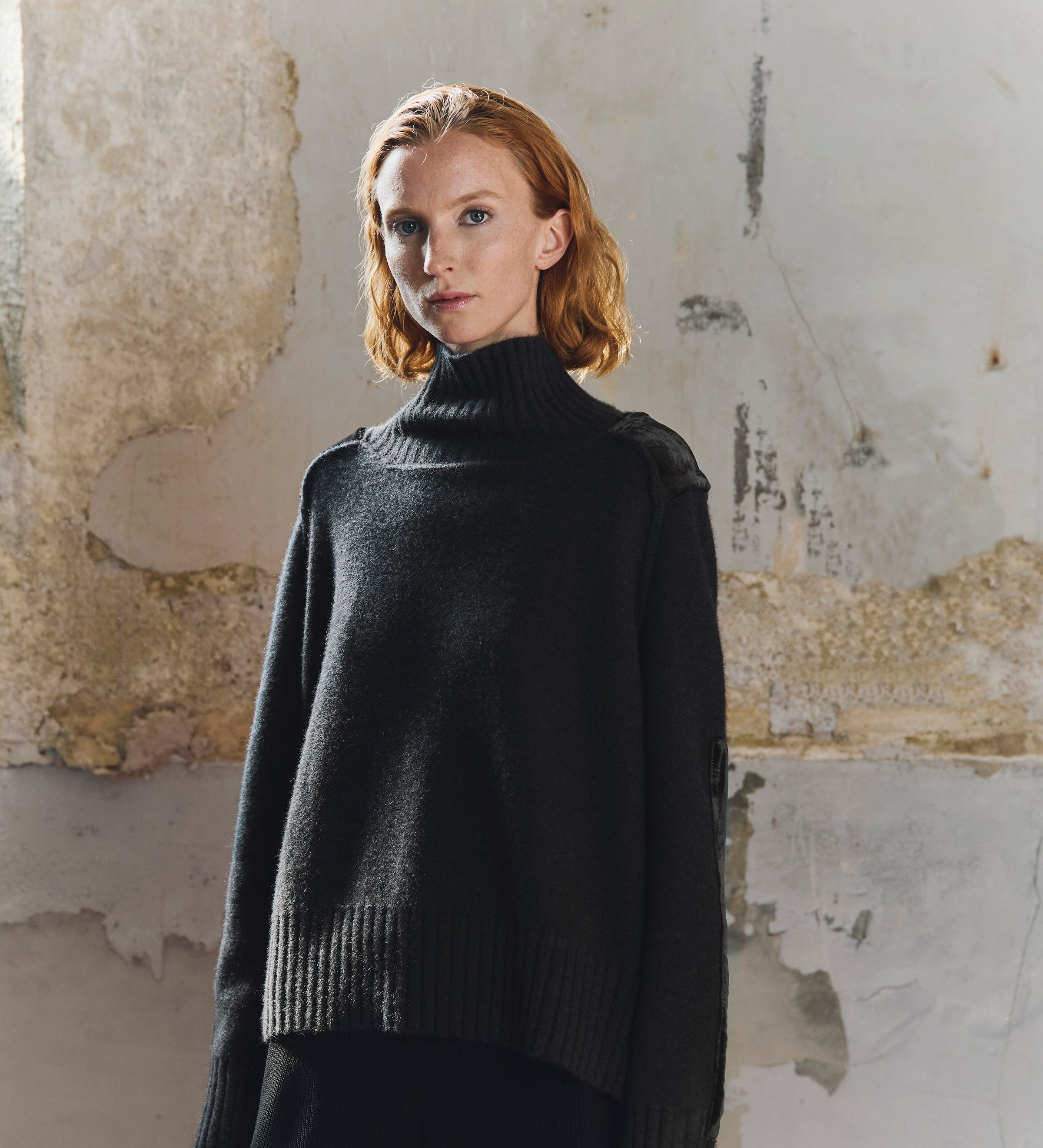 Front view of the Sphere One Episode Sweater in Chocolate Velvet, a cropped 100% cashmere knit with wide rib cuffs and velvet shoulder patches.