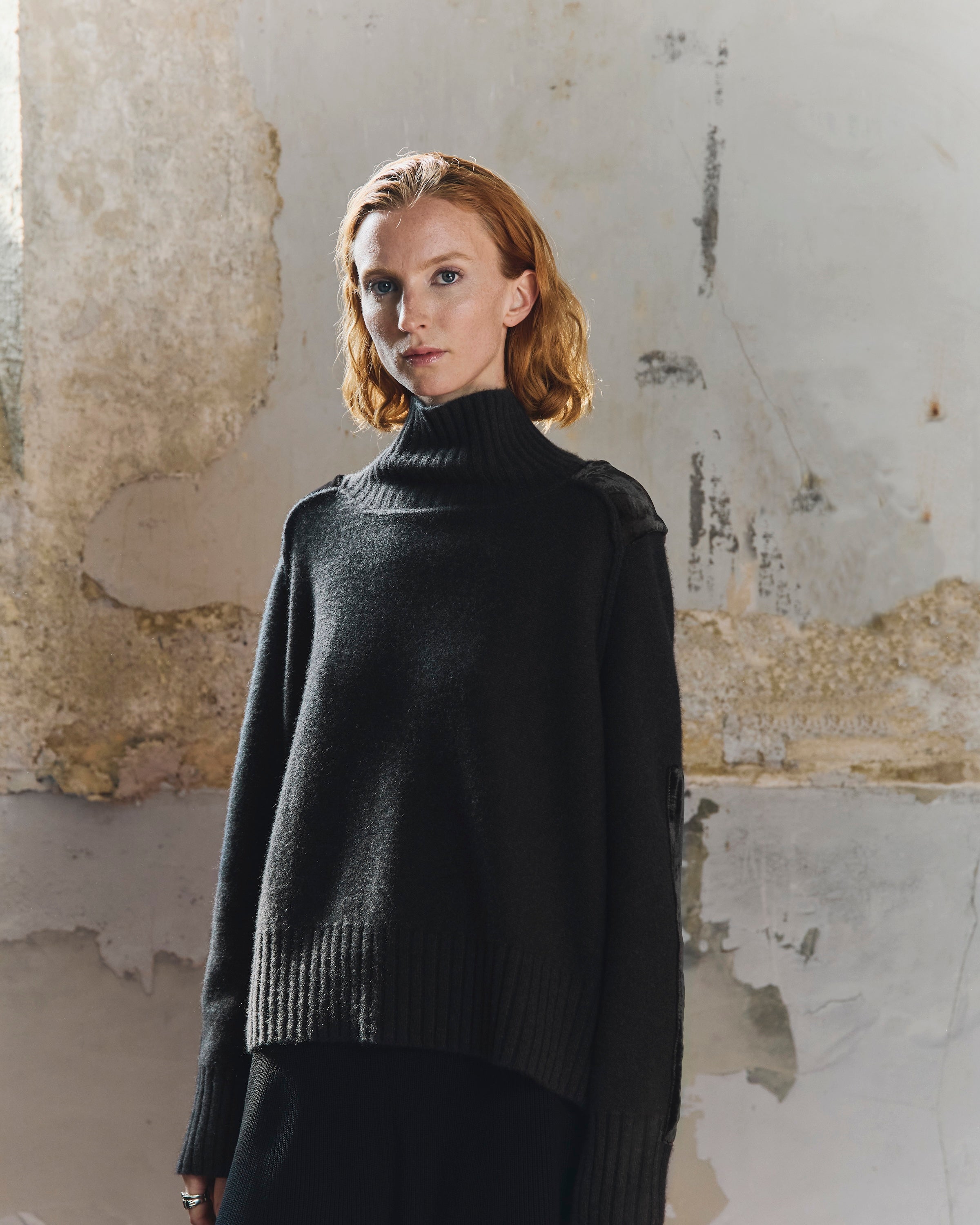 Front view of the Sphere One Episode Sweater in Chocolate Velvet, a cropped 100% cashmere knit with wide rib cuffs and velvet shoulder patches.