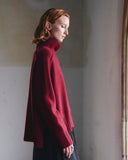 Side detail of the Sphere One Episode Sweater in Cognac Velvet showing cognac velvet patches on the lower sleeves and shoulders.