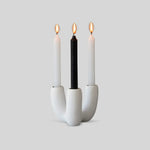 White resin candle holder with soft, organic shape designed by Tina Frey, hand-cast in San Francisco.