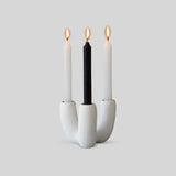 White resin candle holder with soft, organic shape designed by Tina Frey, hand-cast in San Francisco.