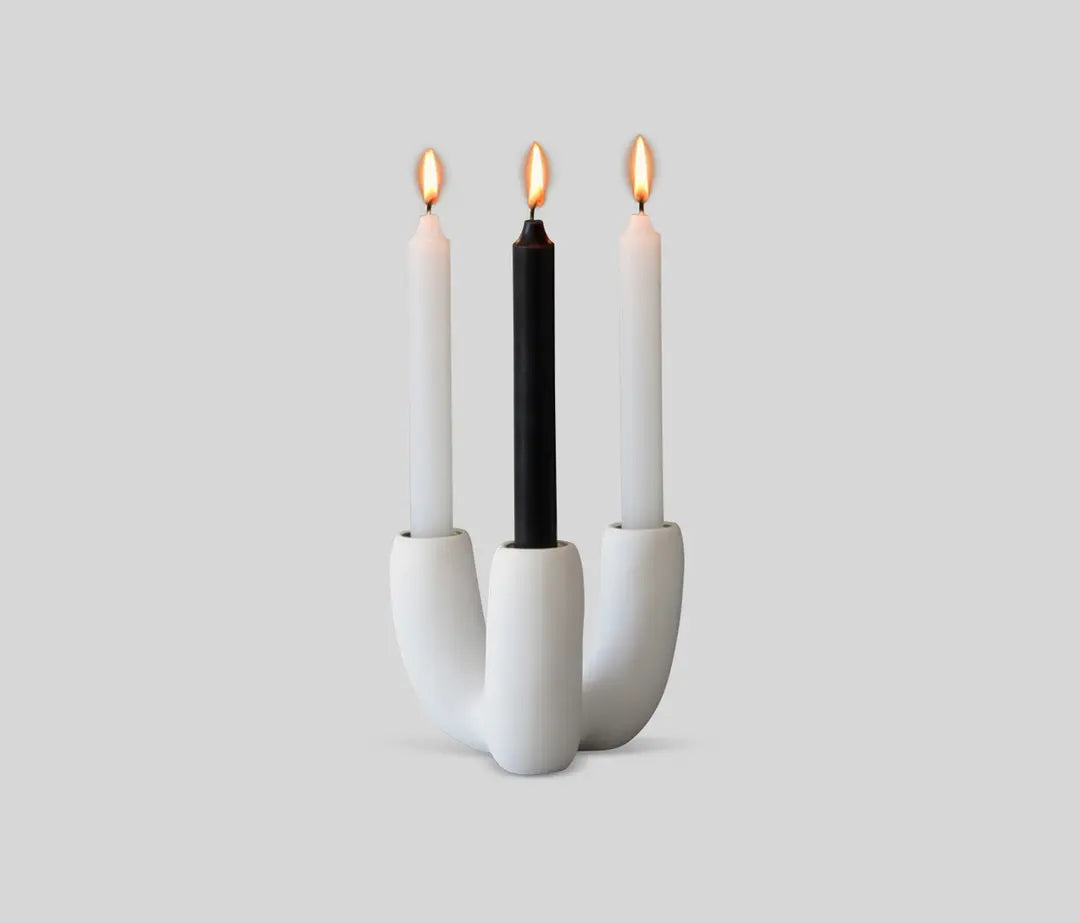 White resin candle holder with soft, organic shape designed by Tina Frey, hand-cast in San Francisco.