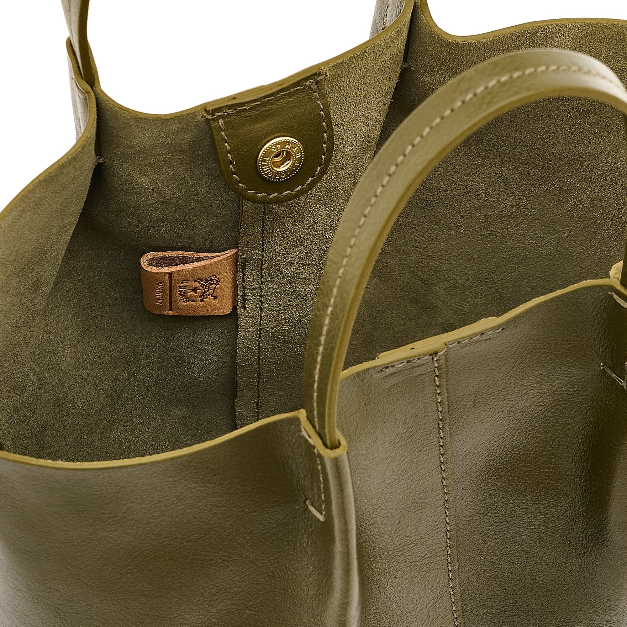 Close-up of a green leather handbag with stitching details