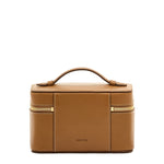 Brown leather travel case with gold zipper on a white background