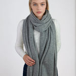 Oversized light gray cashmere Scottish cashmere stole designed in Telluride and made in the USA. Ideal for travel, layering, or staying warm in style.