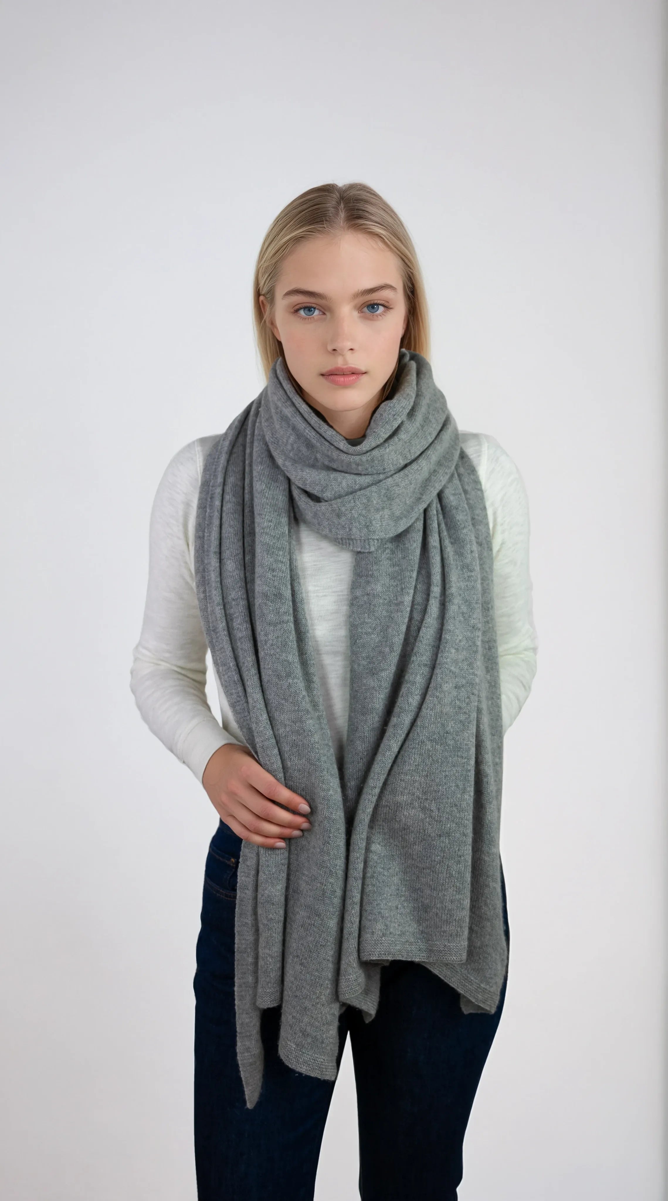 Oversized light gray cashmere Scottish cashmere stole designed in Telluride and made in the USA. Ideal for travel, layering, or staying warm in style.