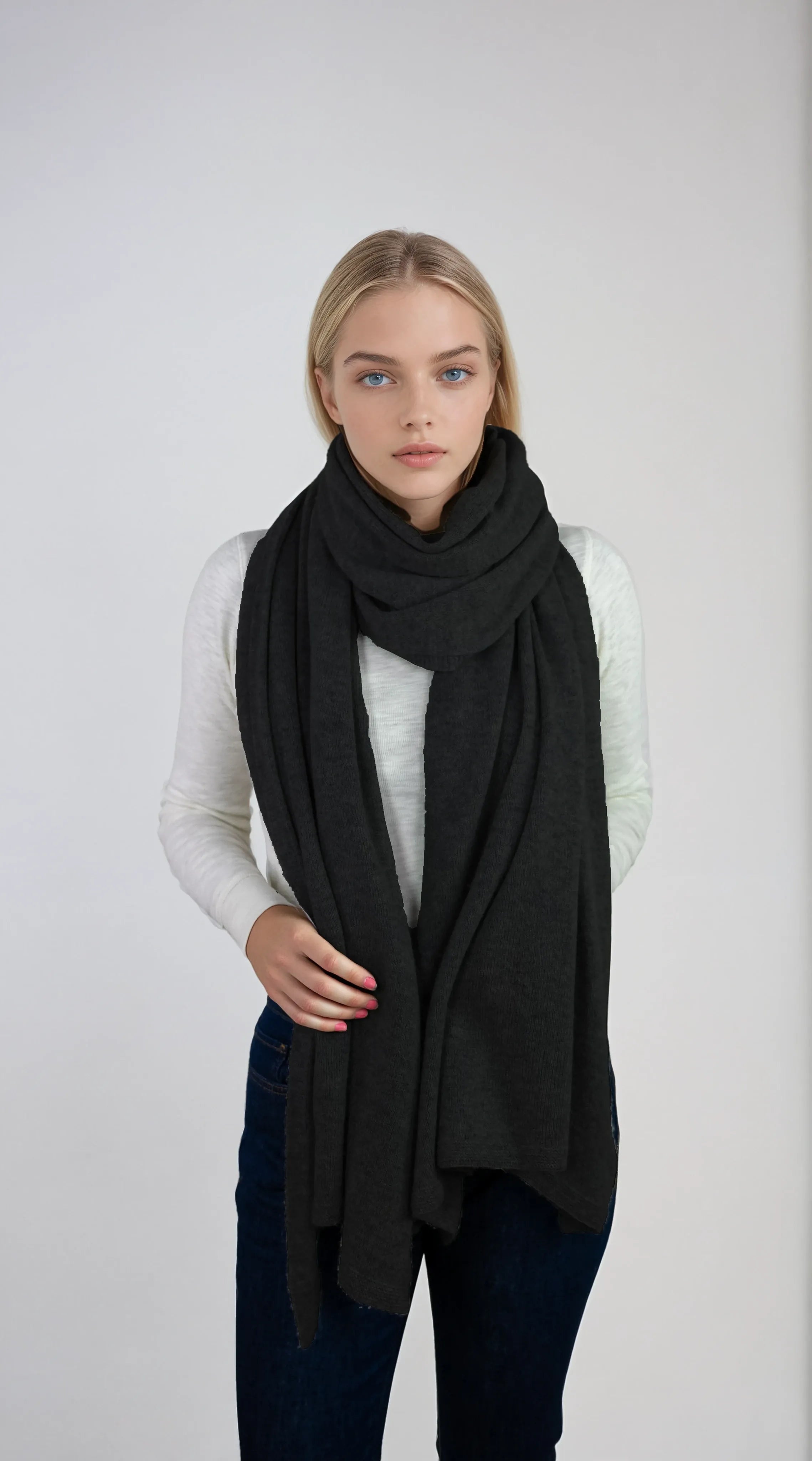 Oversized charcoal gray cashmere Scottish cashmere stole designed in Telluride and made in the USA. Ideal for travel, layering, or staying warm in style.