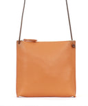 Women's leather crossbody pouch by B.May in tangerine pebbled leather with minimalist design