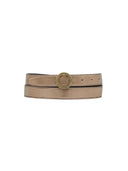 Close-up of Il Bisonte Bigallo belt showing round logo-engraved buckle in polished metal