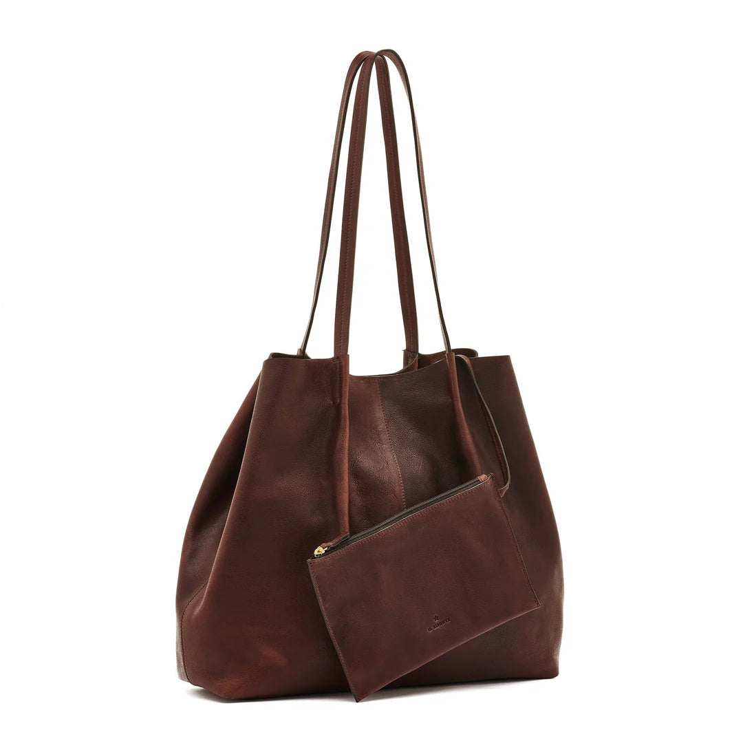 Removable leather pouch inside Il Bisonte Nina tote bag with drawstring and zip closure