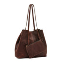 Removable leather pouch inside Il Bisonte Nina tote bag with drawstring and zip closure