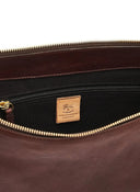 Interior of Il Bisonte Oliveta Hobo Bag featuring cotton canvas lining and zip pocket