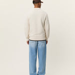 Back view of men's cotton knit polo by Les Deux with long sleeves and textured weave construction
