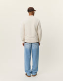 Back view of men's cotton knit polo by Les Deux with long sleeves and textured weave construction