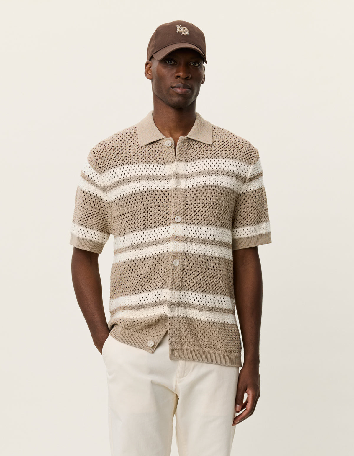 Men's striped knitted short sleeve shirt by Les Deux featuring a collared neckline and button front in a breathable cotton blend