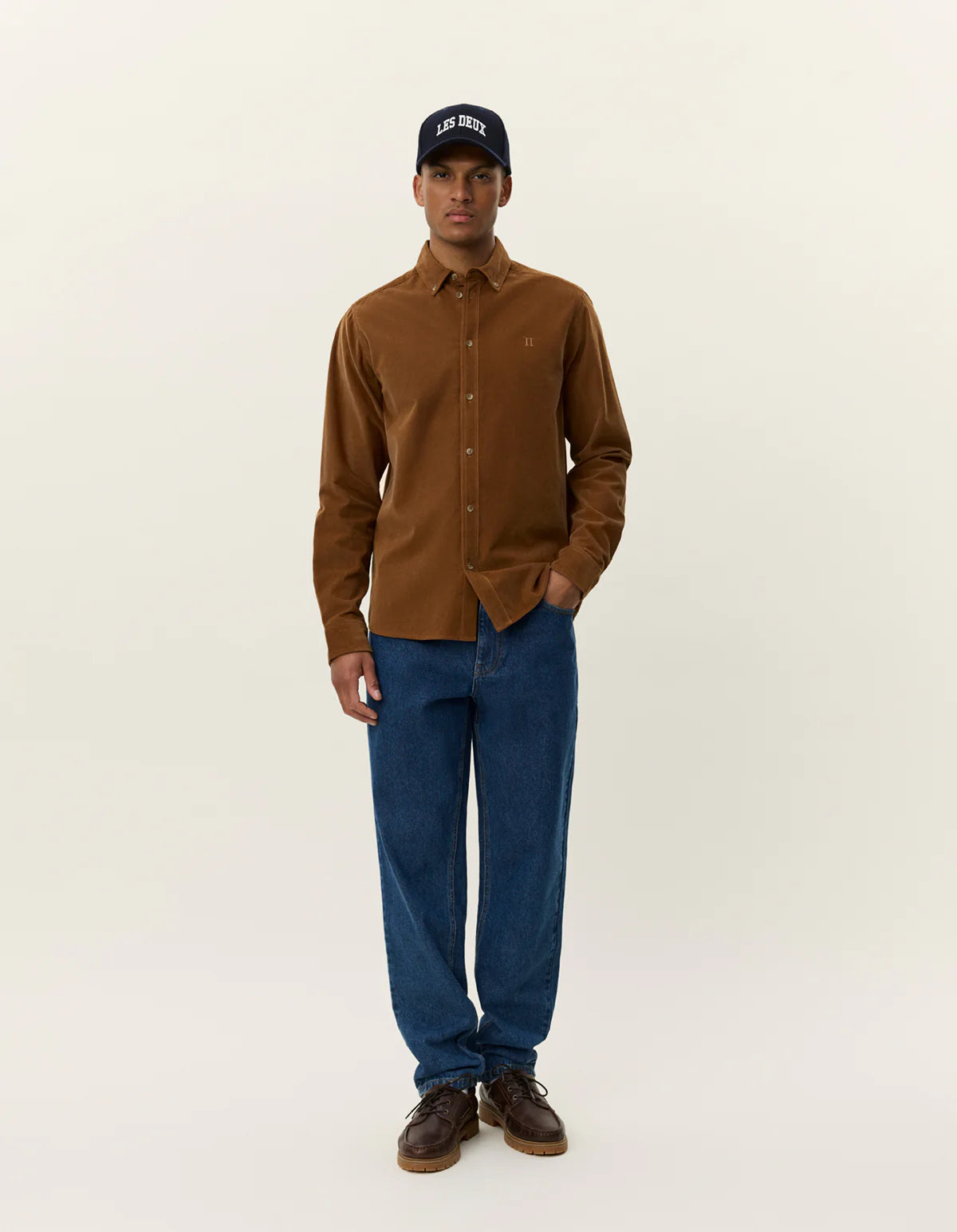 Model wearing Les Deux Konrad Corduroy Shirt in fine organic cotton corduroy, styled as lightweight everyday menswear