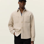 Model wearing Les Deux Lennon Bouclé Overshirt styled as a layered men’s fall look with textured Scandinavian menswear