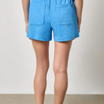 Back view of women's knit cotton shorts by Lilla P with relaxed fit and pockets