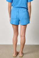 Back view of women's knit cotton shorts by Lilla P with relaxed fit and pockets