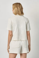 Back view of women's cotton elbow sleeve tee by Lilla P in ecru with clean silhouette