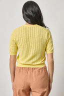 Back view of women's cotton cardigan by Lilla P in lemon with breathable knit texture