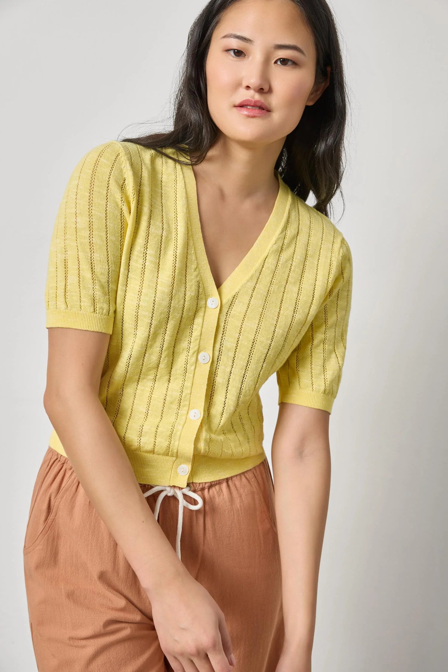 Women's lightweight cotton cardigan by Lilla P in lemon with open stitch knit and V-neck