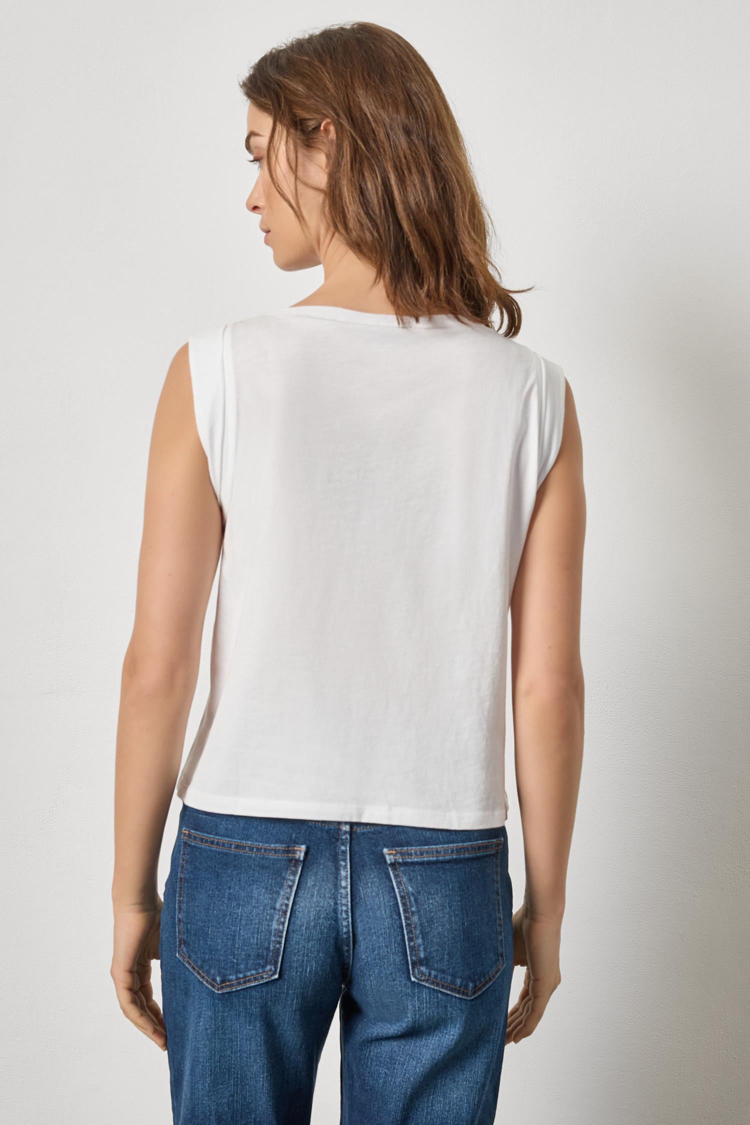 Back view of women's lightweight cotton sleeveless top by Lilla P in white with clean silhouette