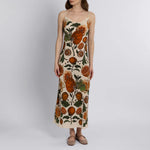 Front view of silk slip dress with citrus fruit and parrot illustration on matte silk crepe
